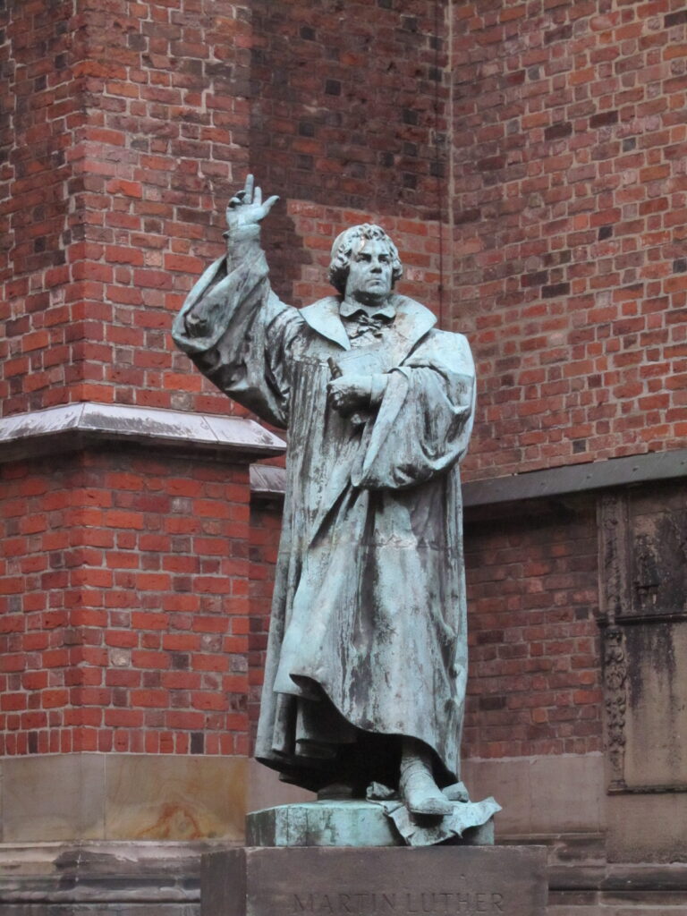 Statue of Martin Luther in front of the Protestant-Lutheran Market Church of St. Georgii